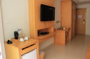 Aspery Hotel room view of amenities with TV and desk