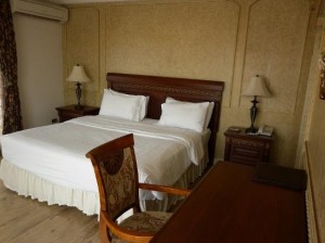 Four Seasons Place Hotel bedroom with desk