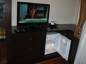 Mirth Sathorn Hotel TV and fridge in room